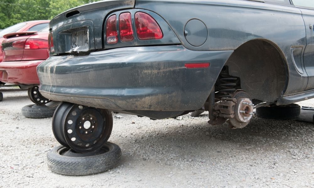 A car that is jacked up using a car jack.